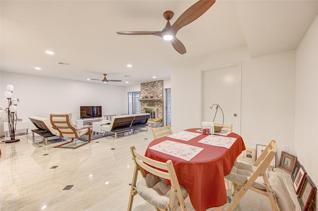 14143 Lost Meadow Ln, Houston, TX 77079 - dining area featuring ceiling fan, a fireplace, and recessed lighting