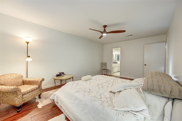 14143 Lost Meadow Ln, Houston, TX 77079 - bedroom featuring wood finished floors, ceiling fan, and connected bathroom