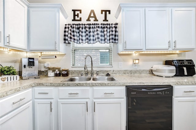 20518 Rimini River Way, Katy, TX 77449 - kitchen with dishwasher, light countertops, and white cabinetry