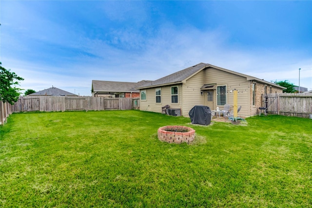 20518 Rimini River Way, Katy, TX 77449 - rear view of property featuring an outdoor fire pit and a fenced backyard