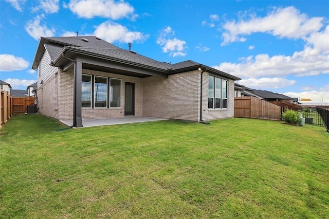 24239 Oakland Mist Ln, Katy, TX 77494 - rear view of house with a patio area, brick siding, and a fenced backyard