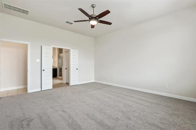 24239 Oakland Mist Ln, Katy, TX 77494 - unfurnished bedroom featuring carpet flooring, connected bathroom, and a ceiling fan