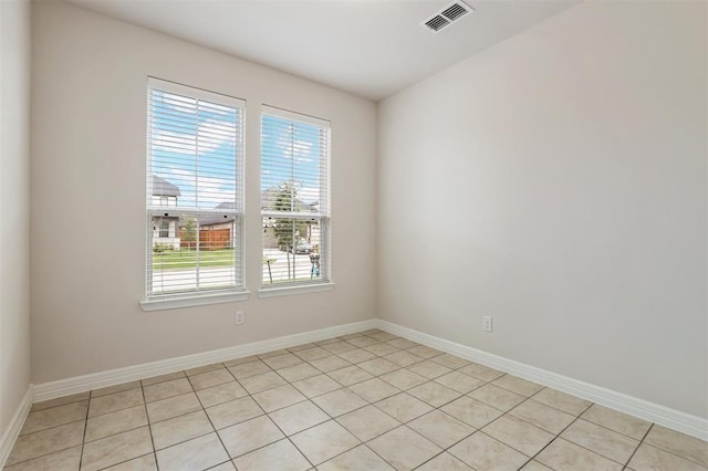 24239 Oakland Mist Ln, Katy, TX 77494 - unfurnished room featuring plenty of natural light and light tile patterned floors