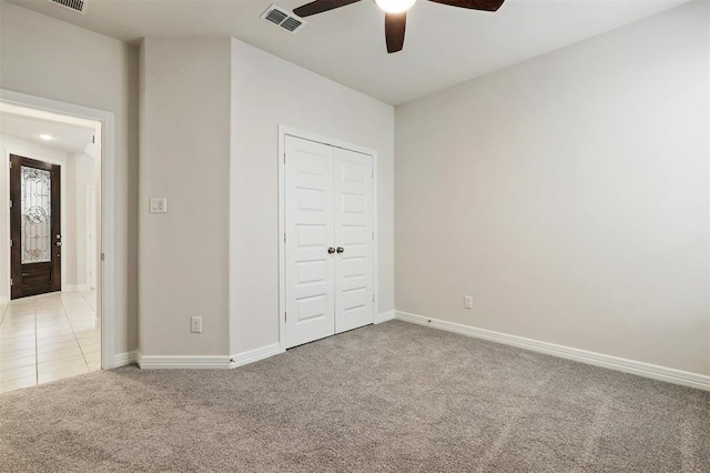 24239 Oakland Mist Ln, Katy, TX 77494 - unfurnished bedroom with light carpet, a closet, and ceiling fan