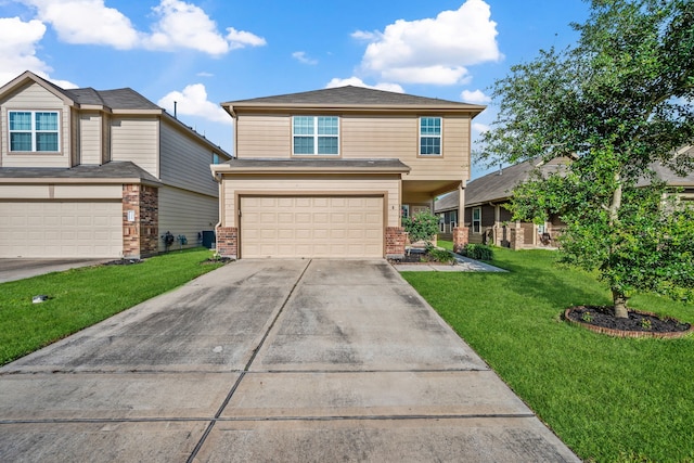 3319 Atascocita Vale Dr, Humble, TX 77396 - traditional-style home featuring an attached garage, brick siding, driveway, and a front lawn