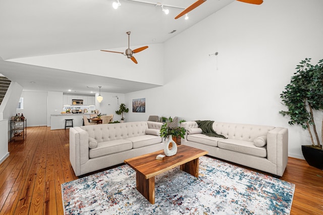 2712 La Branch St, Houston, TX 77004 - living area featuring ceiling fan, light wood-style floors, and high vaulted ceiling