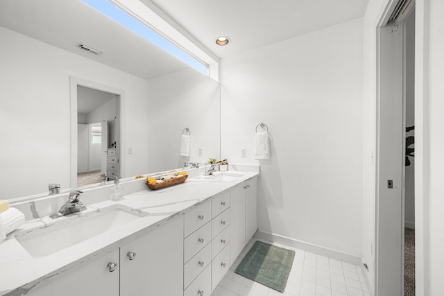 2712 La Branch St, Houston, TX 77004 - bathroom featuring double vanity and tile patterned floors
