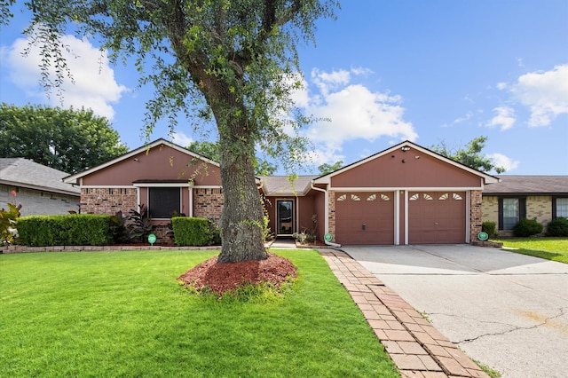 1370 Stevenage Ln, Channelview, TX 77530 - ranch-style home with a garage, a front yard, concrete driveway, and brick siding