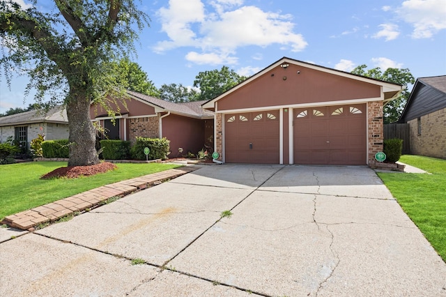 1370 Stevenage Ln, Channelview, TX 77530 - ranch-style house with brick siding, a garage, a front lawn, and concrete driveway