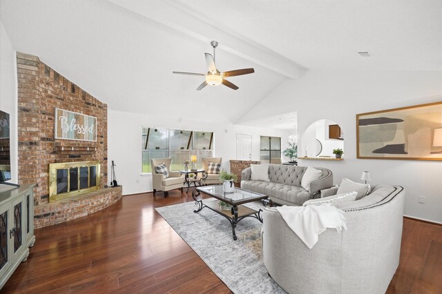 1370 Stevenage Ln, Channelview, TX 77530 - living room featuring beamed ceiling, wood finished floors, a ceiling fan, a fireplace, and high vaulted ceiling