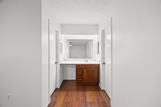 1370 Stevenage Ln, Channelview, TX 77530 - corridor with a textured ceiling and dark wood finished floors