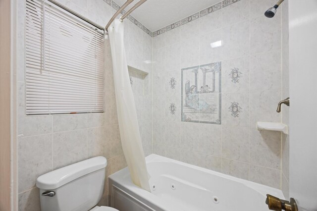 1370 Stevenage Ln, Channelview, TX 77530 - bathroom featuring a combined bath / shower with jetted tub and tile walls