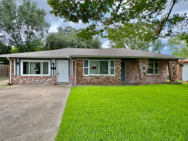 4310 Gallagher Dr, Houston, TX 77045 - single story home with a front yard, brick siding, and roof with shingles