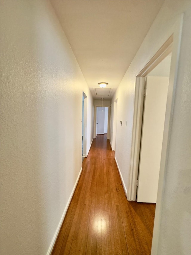 4310 Gallagher Dr, Houston, TX 77045 - corridor with attic access and wood finished floors