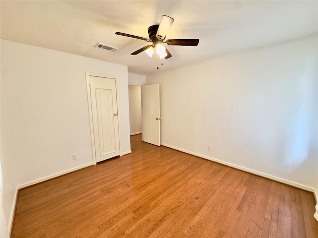4310 Gallagher Dr, Houston, TX 77045 - spare room featuring light wood-type flooring and ceiling fan