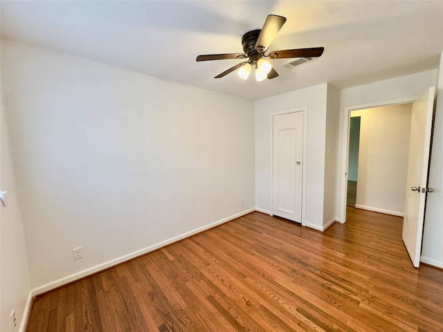 4310 Gallagher Dr, Houston, TX 77045 - unfurnished bedroom with wood finished floors and ceiling fan