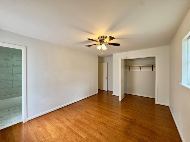 4310 Gallagher Dr, Houston, TX 77045 - unfurnished bedroom featuring wood finished floors, a closet, ensuite bathroom, and a ceiling fan