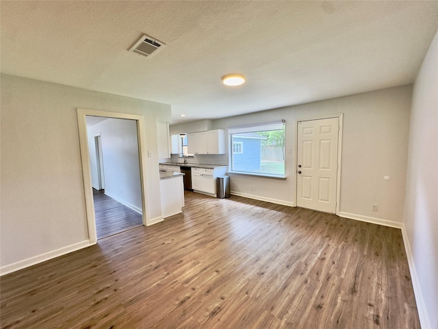4310 Gallagher Dr, Houston, TX 77045 - unfurnished living room featuring dark wood-type flooring