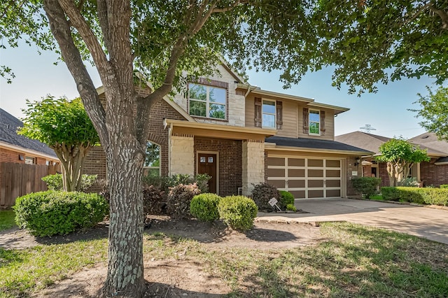 19547 Stetson Heights Ln, Richmond, TX 77407 - view of front facade featuring an attached garage, concrete driveway, stone siding, and brick siding
