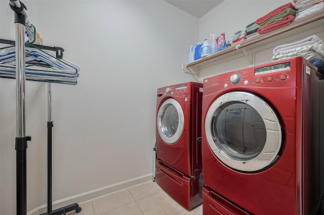 19547 Stetson Heights Ln, Richmond, TX 77407 - laundry room featuring washing machine and dryer and light tile patterned floors