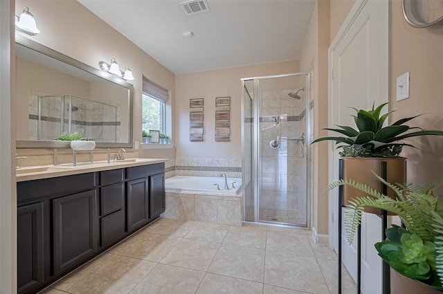 19547 Stetson Heights Ln, Richmond, TX 77407 - bathroom with a shower stall, a bath, tile patterned floors, and double vanity