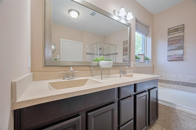 19547 Stetson Heights Ln, Richmond, TX 77407 - bathroom featuring a stall shower, double vanity, and a garden tub