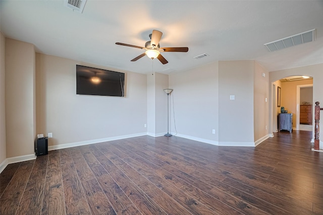 19547 Stetson Heights Ln, Richmond, TX 77407 - unfurnished living room featuring arched walkways, ceiling fan, and dark wood-style floors