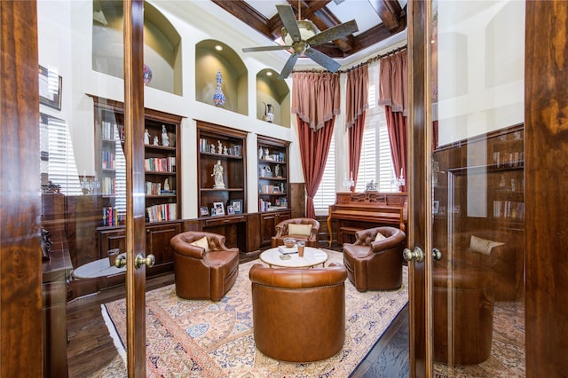 7615 San Clemente Point Ct, Katy, TX 77494 - living area featuring coffered ceiling, a towering ceiling, beam ceiling, a ceiling fan, and built in features