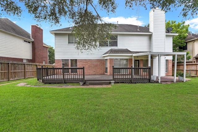 23010 Adwick Ct, Katy, TX 77450 - rear view of house featuring a fenced backyard, a deck, brick siding, and a chimney