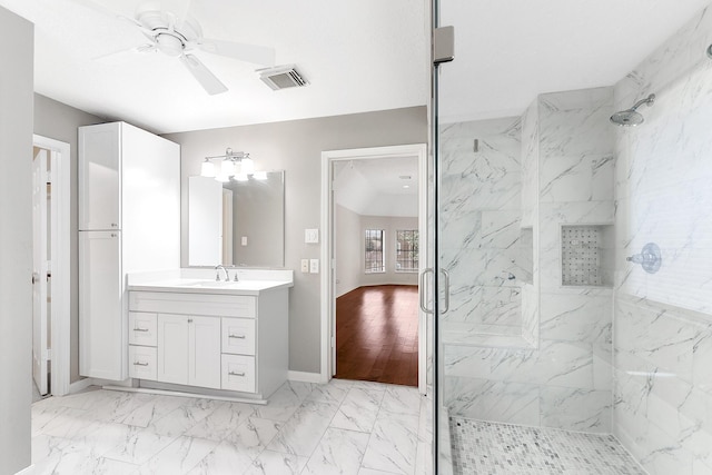23010 Adwick Ct, Katy, TX 77450 - bathroom featuring ceiling fan, a marble finish shower, marble look tile flooring, and vanity