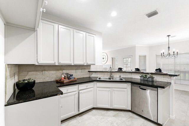 23010 Adwick Ct, Katy, TX 77450 - kitchen with stainless steel dishwasher, decorative backsplash, a peninsula, a chandelier, and recessed lighting