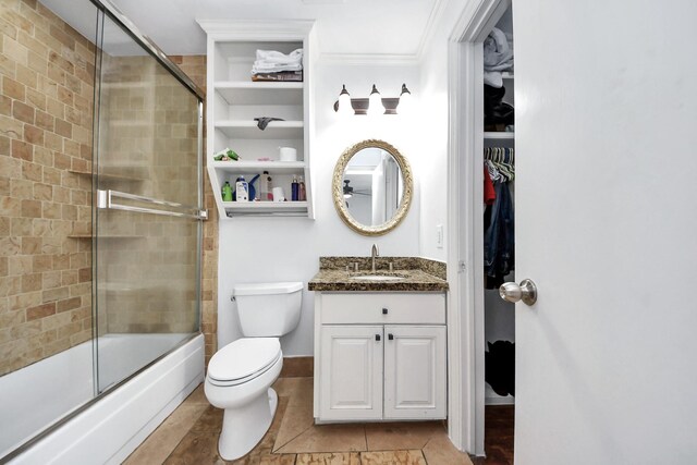 7726 Sorbete Dr, Houston, TX 77083 - bathroom with tile patterned floors, vanity, enclosed tub / shower combo, crown molding, and a spacious closet