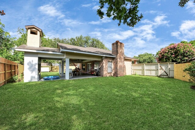 7726 Sorbete Dr, Houston, TX 77083 - rear view of house with a chimney, a patio, and a fenced backyard