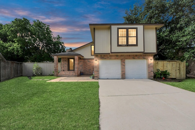 7726 Sorbete Dr, Houston, TX 77083 - view of front of house featuring driveway, a garage, and brick siding