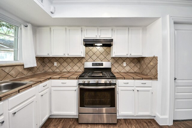 7726 Sorbete Dr, Houston, TX 77083 - kitchen featuring stainless steel gas stove, range hood, tile countertops, and white cabinets