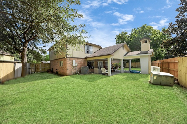 7726 Sorbete Dr, Houston, TX 77083 - rear view of house with a fenced backyard, a patio, and roof with shingles
