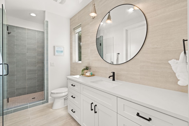 946 Euel Moore Dr, Kingsland, TX 78639 - full bath with vanity, a shower stall, tile walls, and backsplash