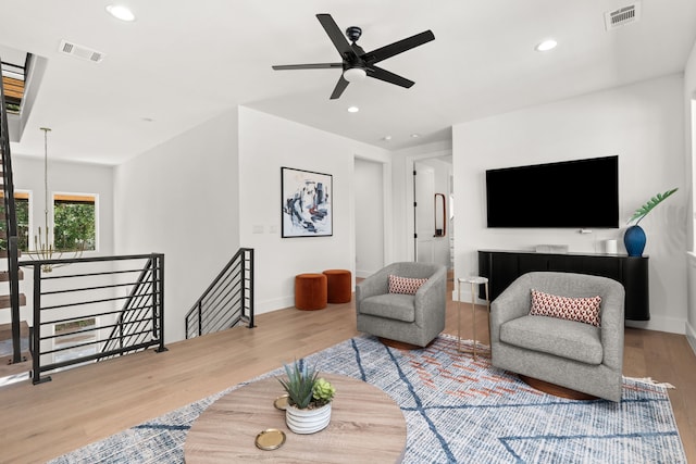 946 Euel Moore Dr, Kingsland, TX 78639 - living room with wood finished floors, ceiling fan, and recessed lighting