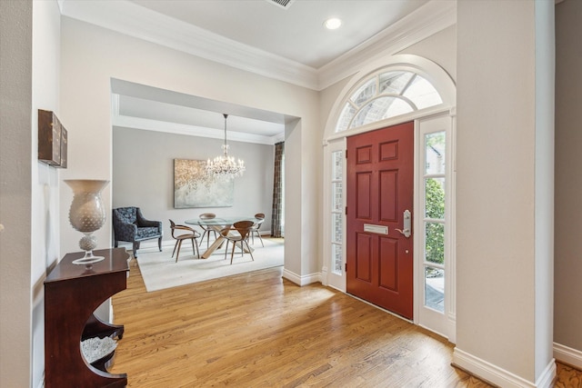 3926 Oberlin St, West University Place, TX 77005 - foyer with ornamental molding, a chandelier, wood finished floors, and recessed lighting