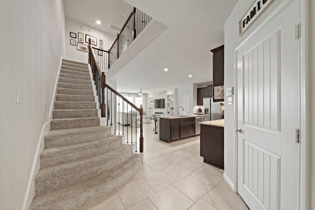 1205 Citruswood Trail Ln, Rosenberg, TX 77471 - stairs featuring tile patterned floors and recessed lighting