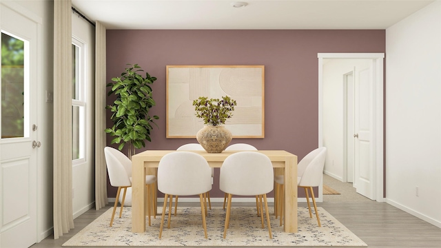 516 Shoreview Dr, Conroe, TX 77303 - dining area with light wood-style flooring and baseboards
