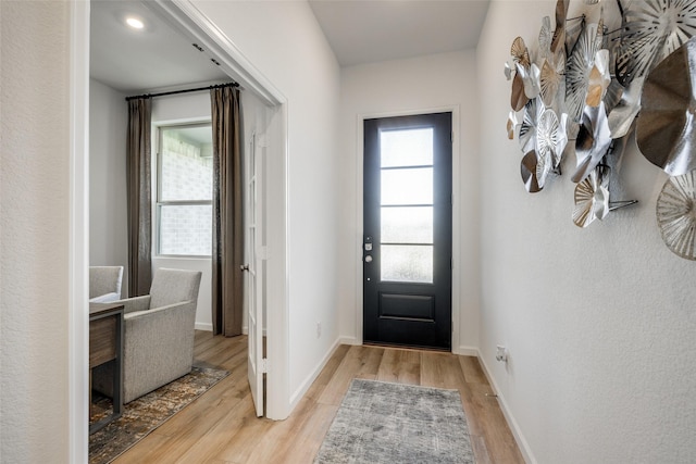 17918 Rillette Rd, Conroe, TX 77302 - entryway with light wood-style flooring and baseboards