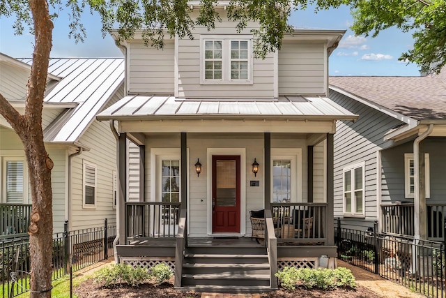 8720 Kempwood Dr, Houston, TX 77080 - view of front of property featuring a porch, a metal roof, and a standing seam roof