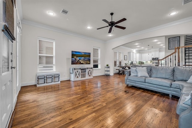 8720 Kempwood Dr, Houston, TX 77080 - living room featuring a ceiling fan, arched walkways, wood finished floors, stairs, and recessed lighting