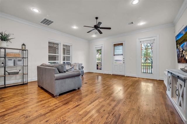 8720 Kempwood Dr, Houston, TX 77080 - living room with ceiling fan, wood finished floors, ornamental molding, and recessed lighting
