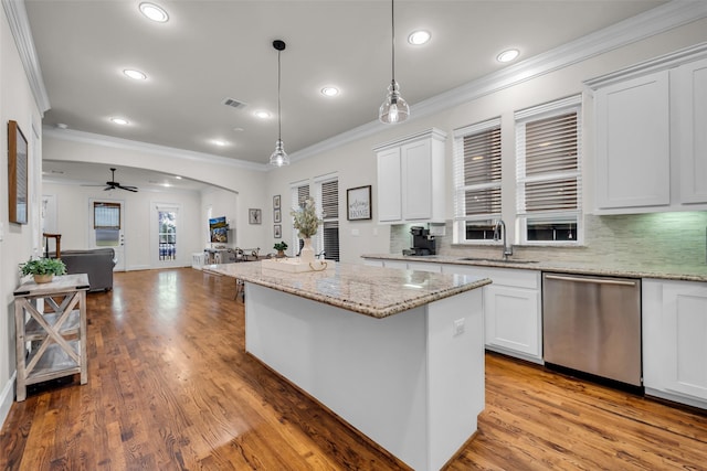 8720 Kempwood Dr, Houston, TX 77080 - kitchen featuring stainless steel dishwasher, crown molding, open floor plan, backsplash, and light wood finished floors