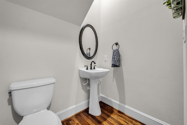 8720 Kempwood Dr, Houston, TX 77080 - half bathroom with toilet and wood finished floors