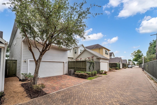 8720 Kempwood Dr, Houston, TX 77080 - view of front of property featuring decorative driveway, a garage, and a residential view