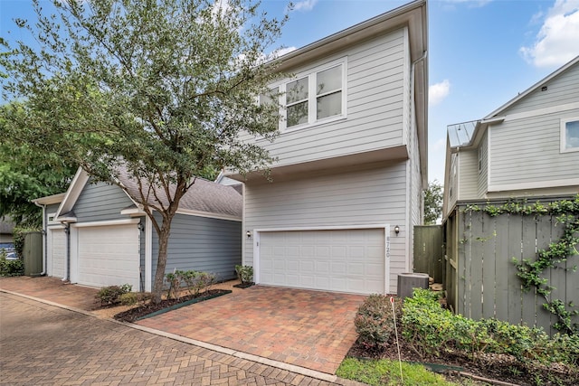 8720 Kempwood Dr, Houston, TX 77080 - view of front of home with decorative driveway and an attached garage