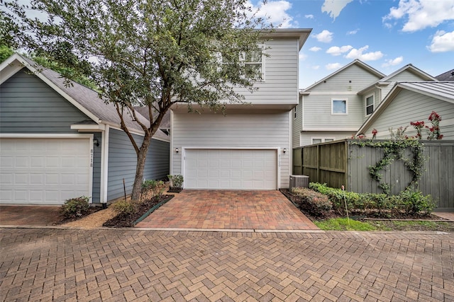 8720 Kempwood Dr, Houston, TX 77080 - view of front of property featuring decorative driveway and a garage